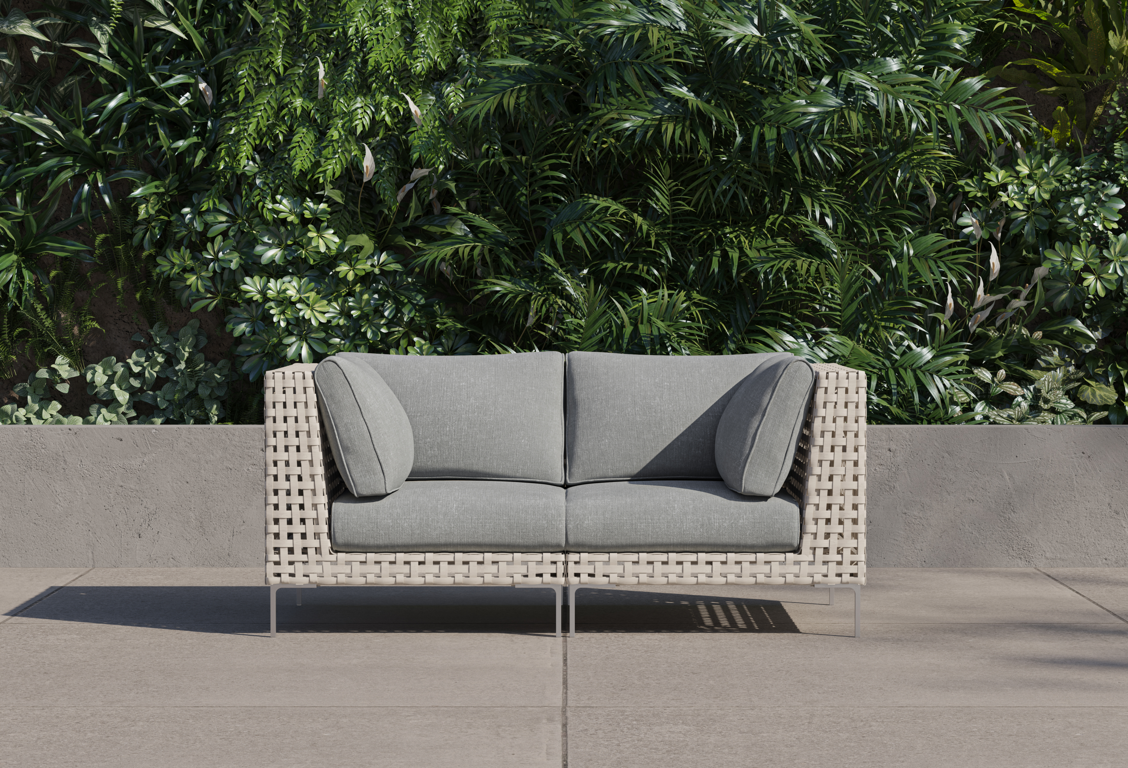 Canapé deux places d'extérieur en osier à tissage ajouré